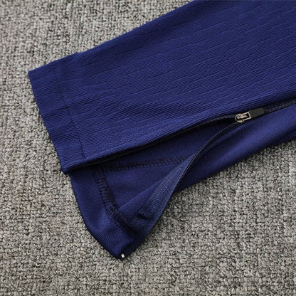 25/26 FC Barcelona Training Orange/Blue Tracksuit from FootballPrestige.com - Premium Football Kits