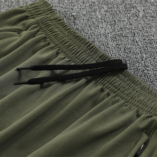 25/26 Real Madrid Training Dark Olive Kids Size Tracksuit from FootballPrestige.com - Premium Football Kits