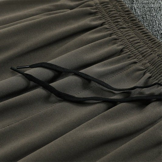 25/26 Real Madrid Training Dark Olive Tracksuit from FootballPrestige.com - Premium Football Kits