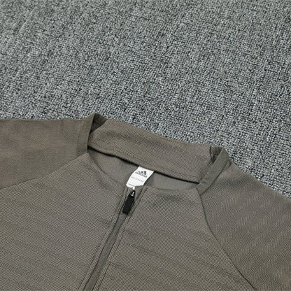 25/26 Real Madrid Training Dark Olive Tracksuit from FootballPrestige.com - Premium Football Kits