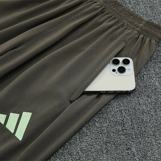 25/26 Real Madrid Training Dark Olive Tracksuit from FootballPrestige.com - Premium Football Kits