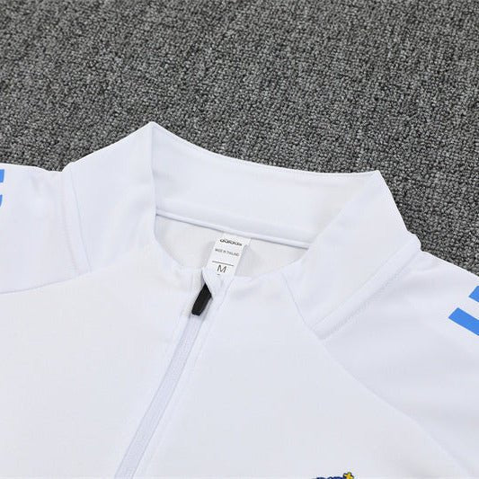 25/26 Real Madrid Training White/Light Blue Kids Size Tracksuit from FootballPrestige.com - Premium Football Kits