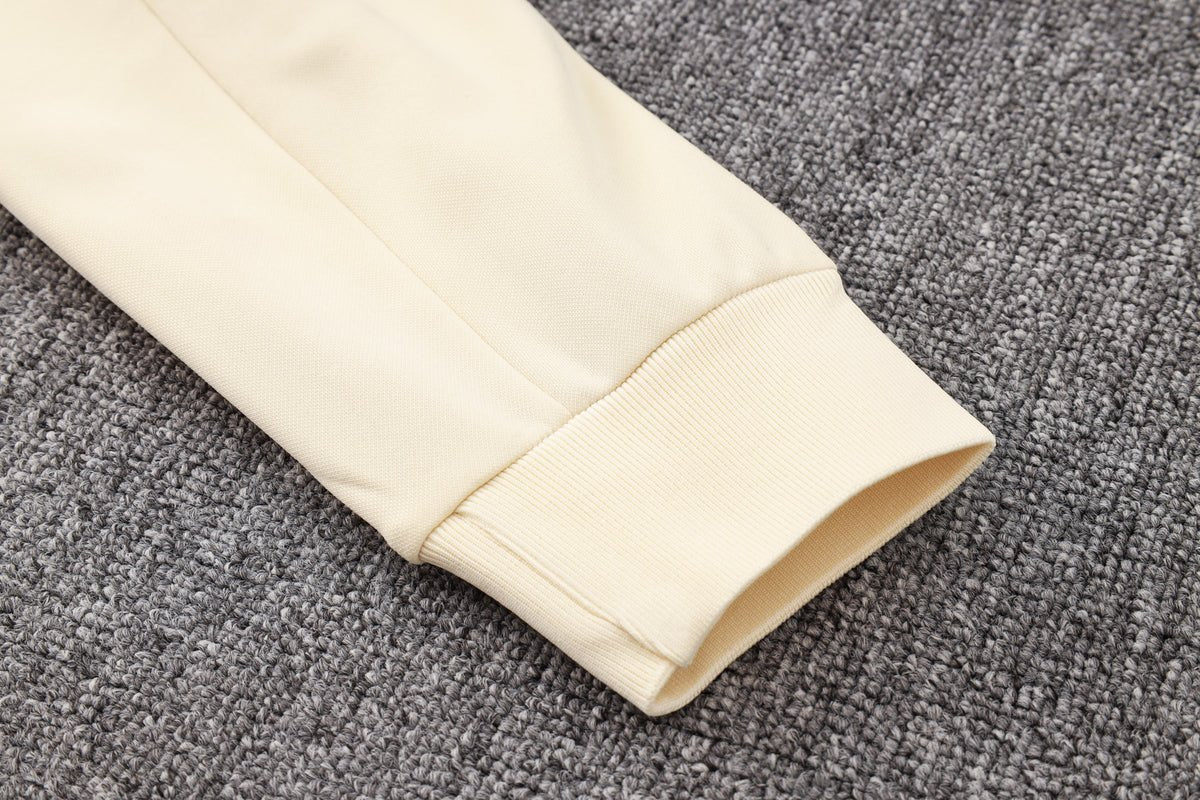 PSG Beige and Black Premium Tracksuit from FootballPrestige.com - Premium Football Kits