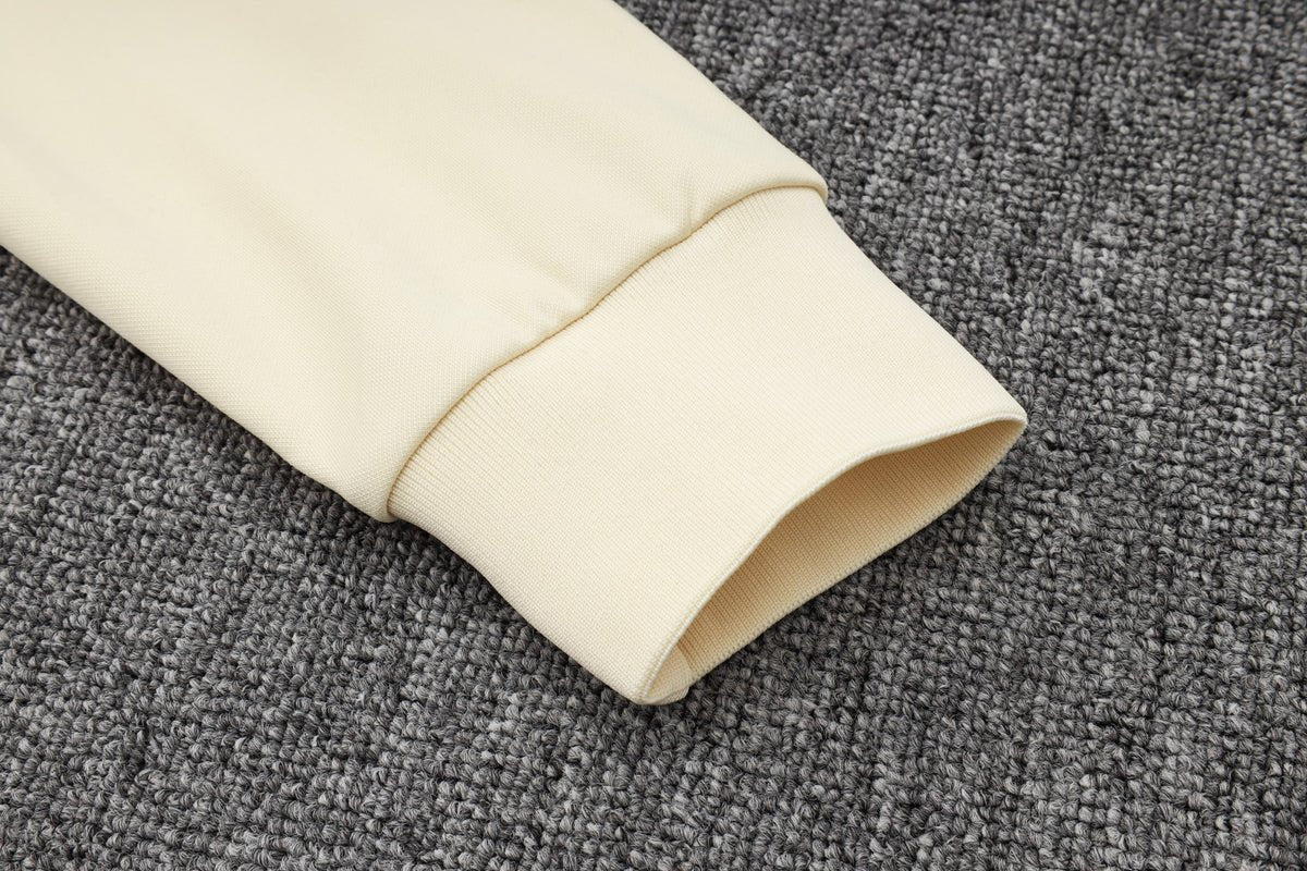 PSG Beige and Dark Blue Premium Tracksuit from FootballPrestige.com - Premium Football Kits