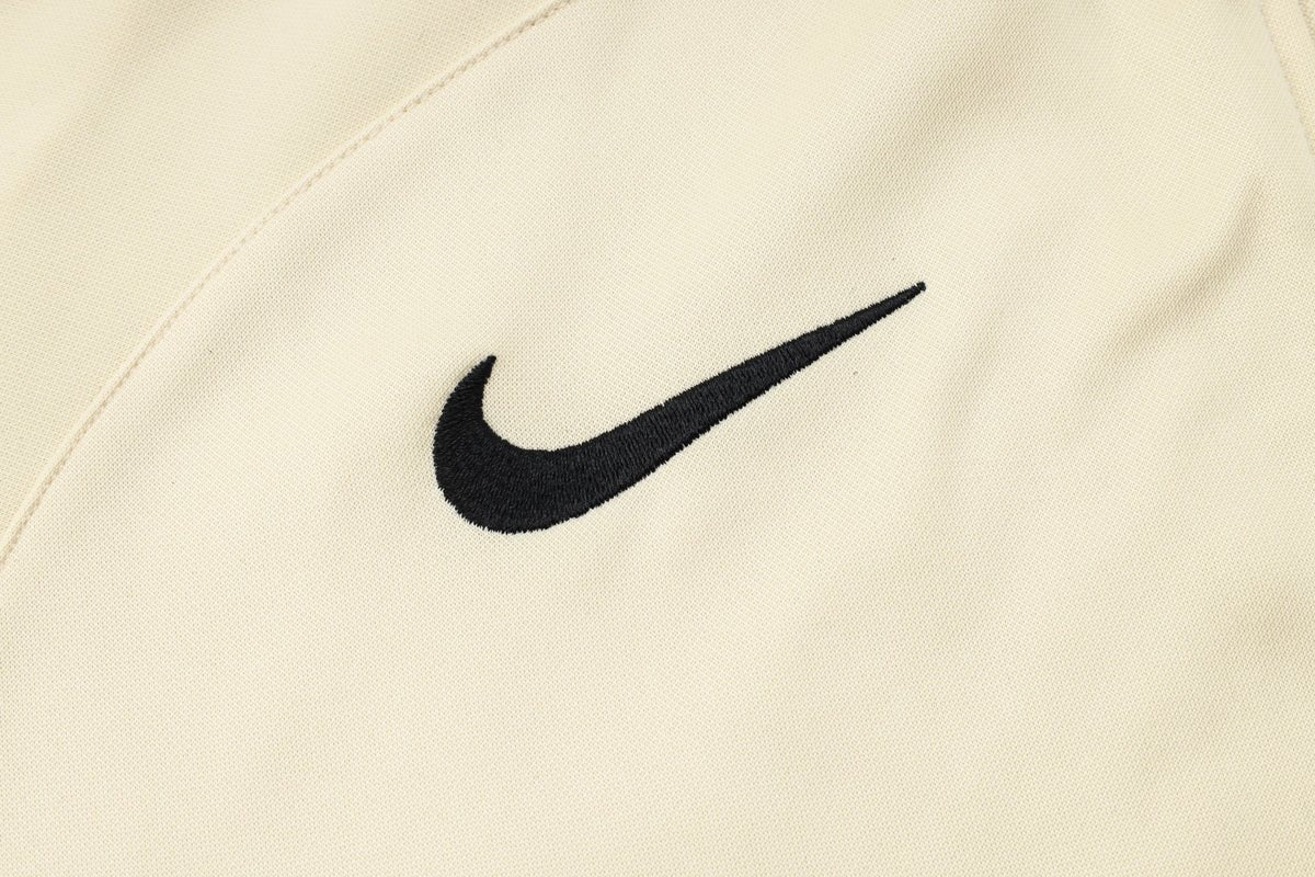 PSG Beige and Dark Blue Premium Tracksuit from FootballPrestige.com - Premium Football Kits