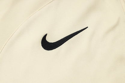PSG Beige and Dark Blue Premium Tracksuit from FootballPrestige.com - Premium Football Kits