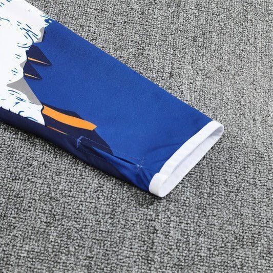 Real Madrid "Azul Reactor" Premium Kids Size Tracksuit from FootballPrestige.com - Premium Football Kits