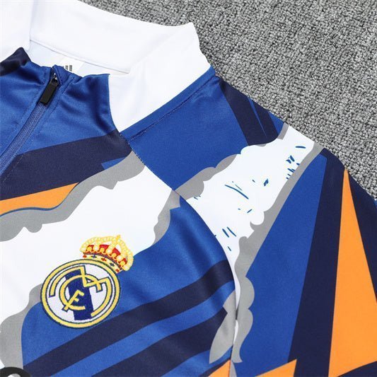 Real Madrid "Azul Reactor" Premium Kids Size Tracksuit from FootballPrestige.com - Premium Football Kits