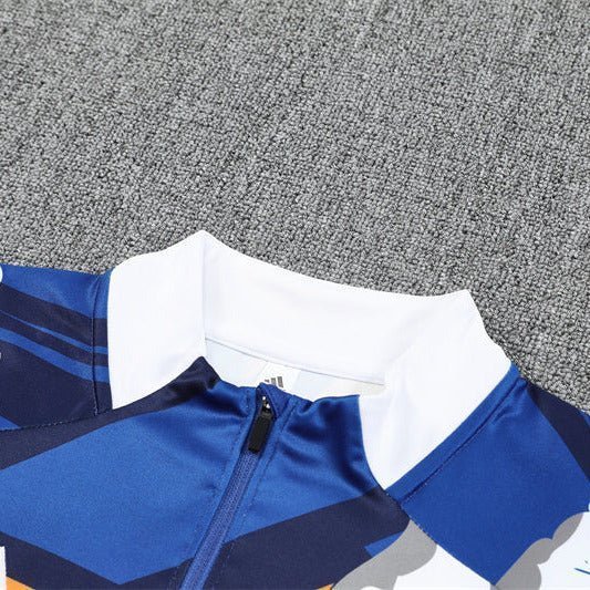 Real Madrid "Azul Reactor" Premium Kids Size Tracksuit from FootballPrestige.com - Premium Football Kits